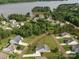 Aerial view of upscale lakeside community surrounded by lush greenery at 11225 Island View Ln, Lancaster, SC 29720
