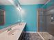 Bright bathroom featuring a double sink vanity, a large mirror, and a modern glass shower at 11225 Island View Ln, Lancaster, SC 29720