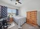Bedroom featuring furnishings with desk, chair, and dresser, and a bed with grey and white patterned comforter at 11225 Island View Ln, Lancaster, SC 29720