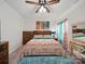 Spacious bedroom featuring an accent rug, a decorative bed, and wooden furniture at 11225 Island View Ln, Lancaster, SC 29720