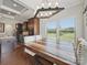 Open dining area features a large table, modern lighting, and seamless flow to the kitchen with stainless steel appliances at 11225 Island View Ln, Lancaster, SC 29720