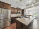 Well-lit kitchen features stainless steel appliances, granite countertops, and a large island perfect for entertaining at 11225 Island View Ln, Lancaster, SC 29720