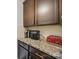 Granite countertop featuring cabinetry and small appliances, ideal for morning coffee at 11225 Island View Ln, Lancaster, SC 29720