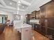 Bright kitchen showcasing an island, stainless steel appliances, and dark wood cabinetry at 11225 Island View Ln, Lancaster, SC 29720
