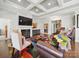 Elegant living room with a fireplace and coffered ceiling providing ample space for entertaining at 11225 Island View Ln, Lancaster, SC 29720