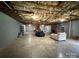 Unfinished basement featuring exposed ceiling beams and concrete floors, ready for customization and ample potential at 117 Lincoln Village Dr, Statesville, NC 28677
