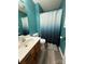 Well-lit bathroom with a single vanity, toilet, and a shower/tub combo at 117 Lincoln Village Dr, Statesville, NC 28677