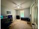 Bedroom featuring carpet, a ceiling fan, a window and a closet at 117 Lincoln Village Dr, Statesville, NC 28677