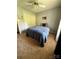Comfortable bedroom with plush carpeting, a ceiling fan, and ample closet space at 117 Lincoln Village Dr, Statesville, NC 28677
