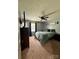 Cozy bedroom with a queen-sized bed, soft carpet, and natural lighting at 117 Lincoln Village Dr, Statesville, NC 28677