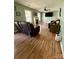 Bright living room featuring hardwood floors, a fireplace, and a flat-screen TV at 117 Lincoln Village Dr, Statesville, NC 28677