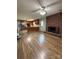 Cozy living room featuring a brick fireplace and a ceiling fan and seamlessly connects to a modern kitchen at 117 Lincoln Village Dr, Statesville, NC 28677