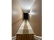 Stairway leading to the basement with wooden rails at 117 Lincoln Village Dr, Statesville, NC 28677