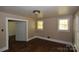 Bedroom with hardwood floors, featuring natural light from two windows at 1216 Mountain Ave, Gastonia, NC 28052