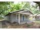 Single-story home with a covered front porch and classic architectural details at 1216 Mountain Ave, Gastonia, NC 28052