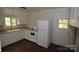 A cozy kitchen features essential appliances and ample natural light at 1216 Mountain Ave, Gastonia, NC 28052