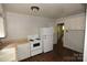 Practical kitchen design featuring white appliances and efficient layout at 1216 Mountain Ave, Gastonia, NC 28052