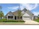 Charming single-story home with white siding, black shutters, and a well-manicured lawn under a bright blue sky at 12184 Muscadine Ct, Midland, NC 28107