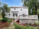 Backyard featuring a deck, lush landscaping and a stone pathway at 124 Creek Hollow Trl, Belmont, NC 28012