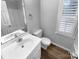 Bathroom featuring a white vanity, toilet, and a bathtub and shower combo at 124 Creek Hollow Trl, Belmont, NC 28012