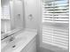 Bathroom vanity featuring a large mirror, ample counter space, and natural light at 124 Creek Hollow Trl, Belmont, NC 28012
