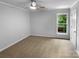 Bedroom featuring neutral carpeting, light gray walls and natural light from a window at 124 Creek Hollow Trl, Belmont, NC 28012