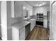 Modern kitchen featuring white cabinets, stainless steel appliances, and sleek countertops at 124 Creek Hollow Trl, Belmont, NC 28012