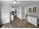 Open kitchen area with stainless steel appliances, plenty of storage, and updated flooring at 124 Creek Hollow Trl, Belmont, NC 28012