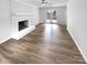 A spacious living room features hard surface floors and a large fireplace at 124 Creek Hollow Trl, Belmont, NC 28012