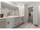 Bathroom with double sink vanity, white cabinets and tile flooring at 12536 Stoneybrook Pkwy, Huntersville, NC 28078