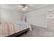 Bright bedroom featuring a ceiling fan, and neutral color palette at 12536 Stoneybrook Pkwy, Huntersville, NC 28078