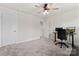 Bedroom featuring a ceiling fan, desk, and neutral color palette at 12536 Stoneybrook Pkwy, Huntersville, NC 28078
