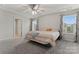 Bedroom featuring a bed, ceiling fan, and windows at 12536 Stoneybrook Pkwy, Huntersville, NC 28078
