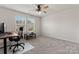 Bright bedroom with two windows, ceiling fan and neutral carpet at 12536 Stoneybrook Pkwy, Huntersville, NC 28078