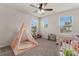 Bright bedroom with two windows and room decor at 12536 Stoneybrook Pkwy, Huntersville, NC 28078