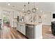 Modern kitchen with a large island, stainless steel appliances, and open floorplan at 12536 Stoneybrook Pkwy, Huntersville, NC 28078