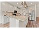 Bright kitchen featuring white cabinets, granite countertops and stainless appliances at 12536 Stoneybrook Pkwy, Huntersville, NC 28078