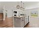 Open concept kitchen with stainless steel appliances and a center island at 12536 Stoneybrook Pkwy, Huntersville, NC 28078