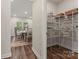View of pantry with wire shelving, conveniently located off the dining room, with hardwood floors at 12536 Stoneybrook Pkwy, Huntersville, NC 28078