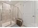 Shower with glass door and tiled walls at 12536 Stoneybrook Pkwy, Huntersville, NC 28078