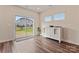 Sunroom with a sliding glass door leading to backyard, hardwood floors, and white dresser at 12536 Stoneybrook Pkwy, Huntersville, NC 28078