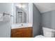 Bathroom featuring a double sink vanity, mirror, and standard toilet at 126 Rocky Trail Ct, Fort Mill, SC 29715