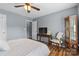 This cozy bedroom has wood floors, a TV, and a classic curio cabinet at 126 Rocky Trail Ct, Fort Mill, SC 29715