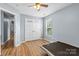 A bedroom is shown with wood floors, closet, and a window at 126 Rocky Trail Ct, Fort Mill, SC 29715