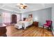 Bedroom with hardwood floors, ceiling fan, and a light pink color scheme at 126 Rocky Trail Ct, Fort Mill, SC 29715