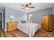 Bedroom featuring hardwood floors, ceiling fan, and two dressers at 126 Rocky Trail Ct, Fort Mill, SC 29715