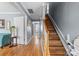 Bright hallway featuring hardwood floors, painted walls, and a motorized chair lift at 126 Rocky Trail Ct, Fort Mill, SC 29715