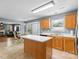 Open concept kitchen with island, wood cabinetry, and ample counter space at 126 Rocky Trail Ct, Fort Mill, SC 29715