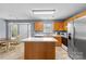Well-lit kitchen features an island, modern appliances, and wood cabinetry at 126 Rocky Trail Ct, Fort Mill, SC 29715