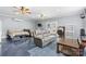 Inviting living room with comfortable leather seating, ceiling fans, and a desk area at 126 Rocky Trail Ct, Fort Mill, SC 29715